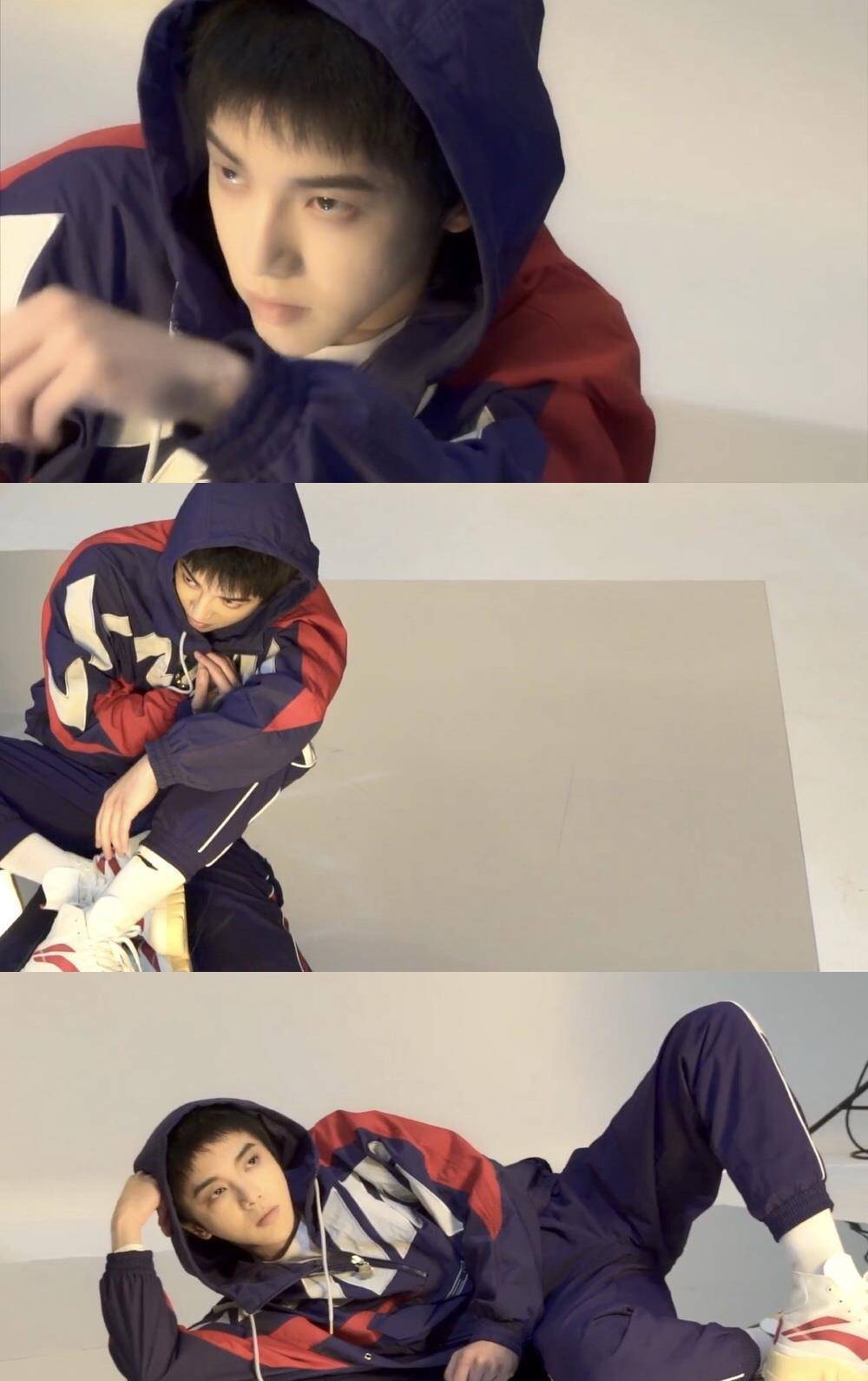 华晨宇拿下国牌代言,红蓝拼接卫衣烟熏妆,慵懒躺地上拍策划_黑色_运动